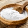 baking-soda-for-bath-in-wooden-bowl-with-wooden-spoon